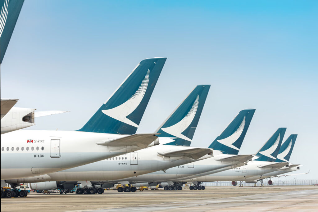 A line of parked Cathay Pacific aircraft.