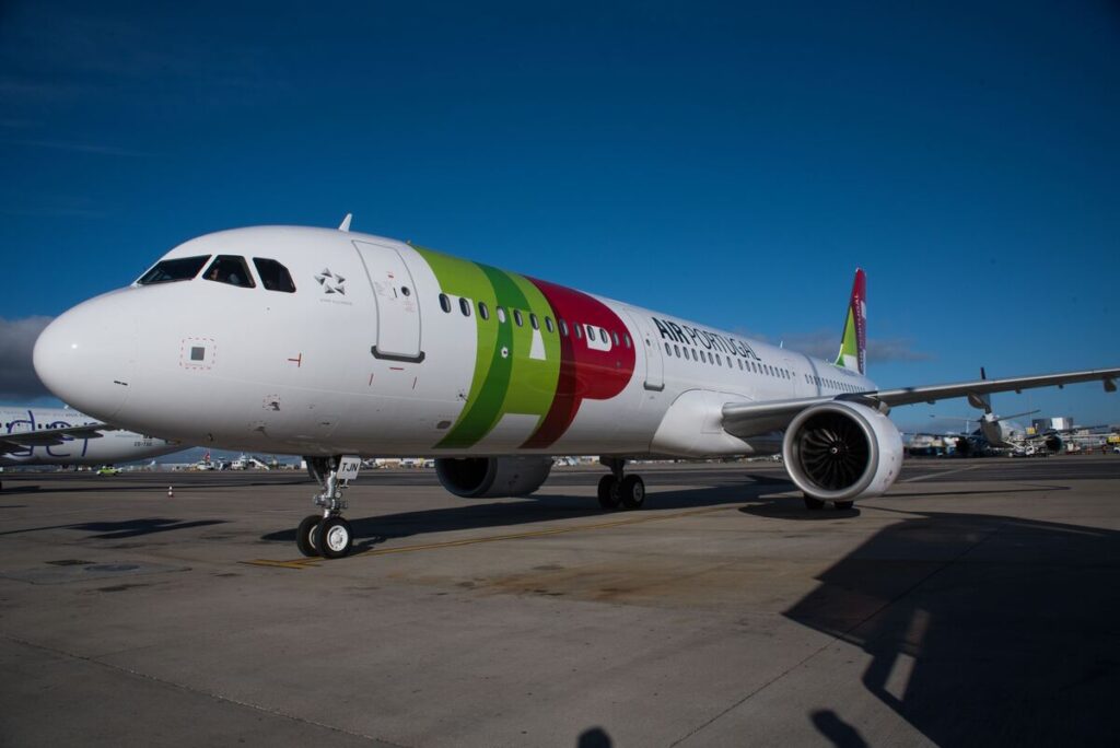 A TAP Air Portugal A321neo parked on the tarmac.