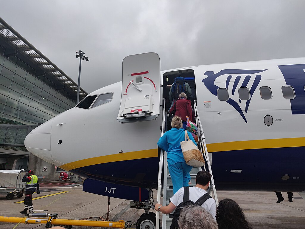 Passengers board a Ryanair aircraft